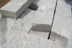 A pile of concrete blocks sitting on top of each other on a table.