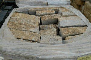 A pile of bricks wrapped in plastic is sitting on top of a table.