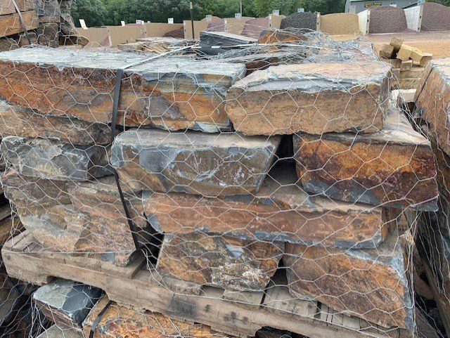A pile of rocks stacked on top of each other on a wooden pallet.