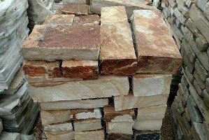 A pile of bricks stacked on top of each other.