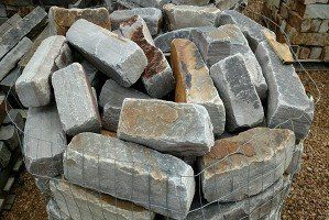 A pile of rocks is sitting on top of a pile of gravel.