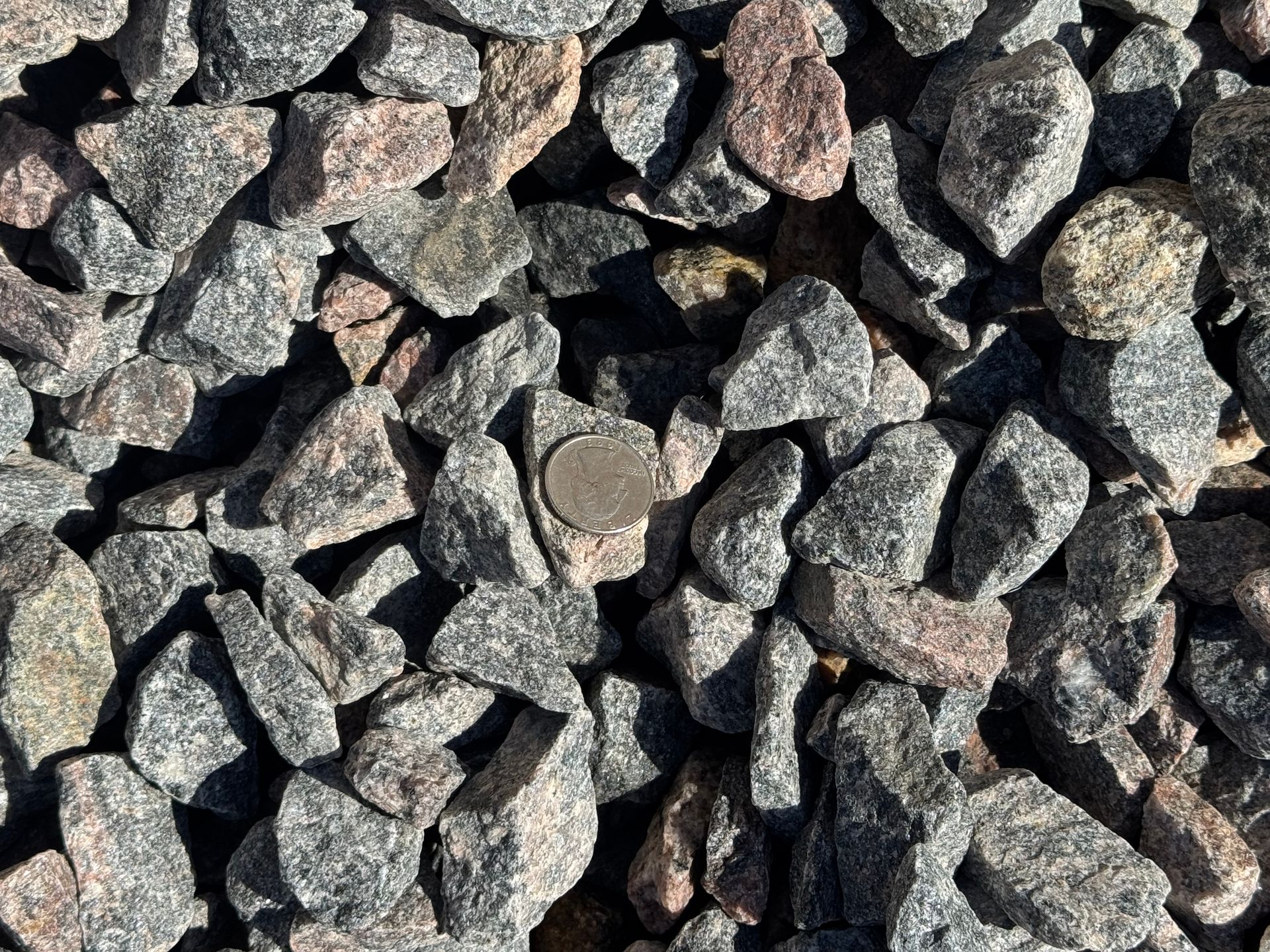 A pile of gravel with a lot of rocks in it.