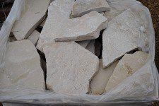 A pile of white rocks in a plastic bag.