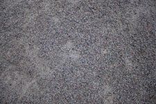 A close up of a gray carpet texture.