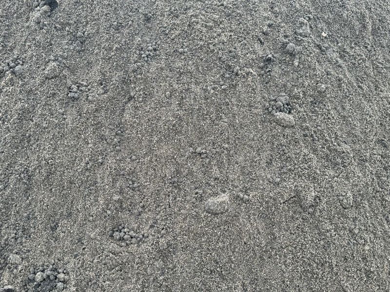 A pile of gravel is sitting on the ground.