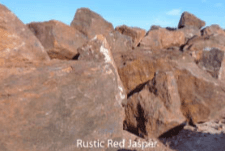 A pile of rocks with the words `` rustic red jasper '' written on the bottom.