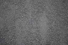 A close up of a pile of gravel on the ground.