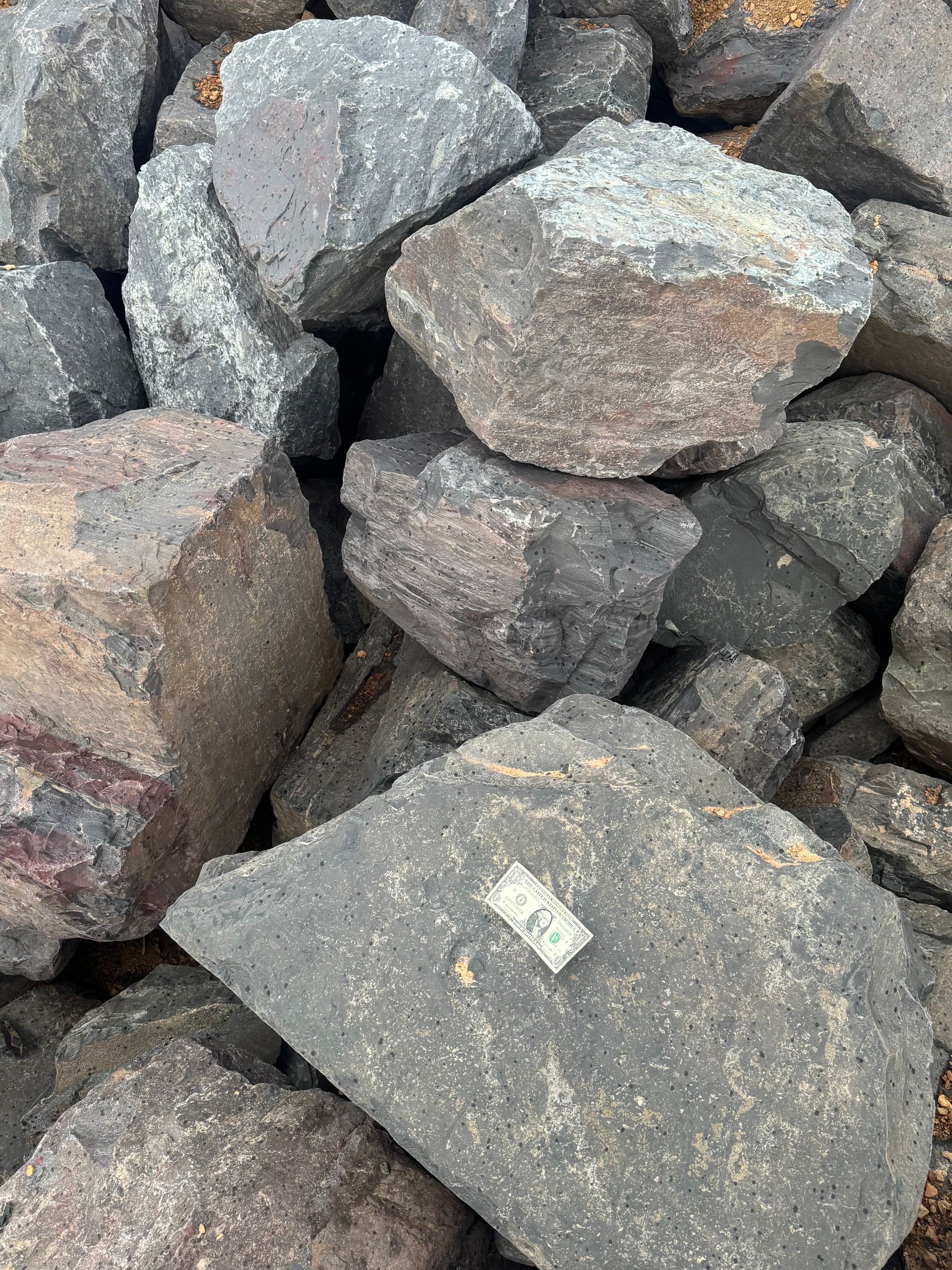 A close up of a rock with the words mesabi blend outcropping on it.
