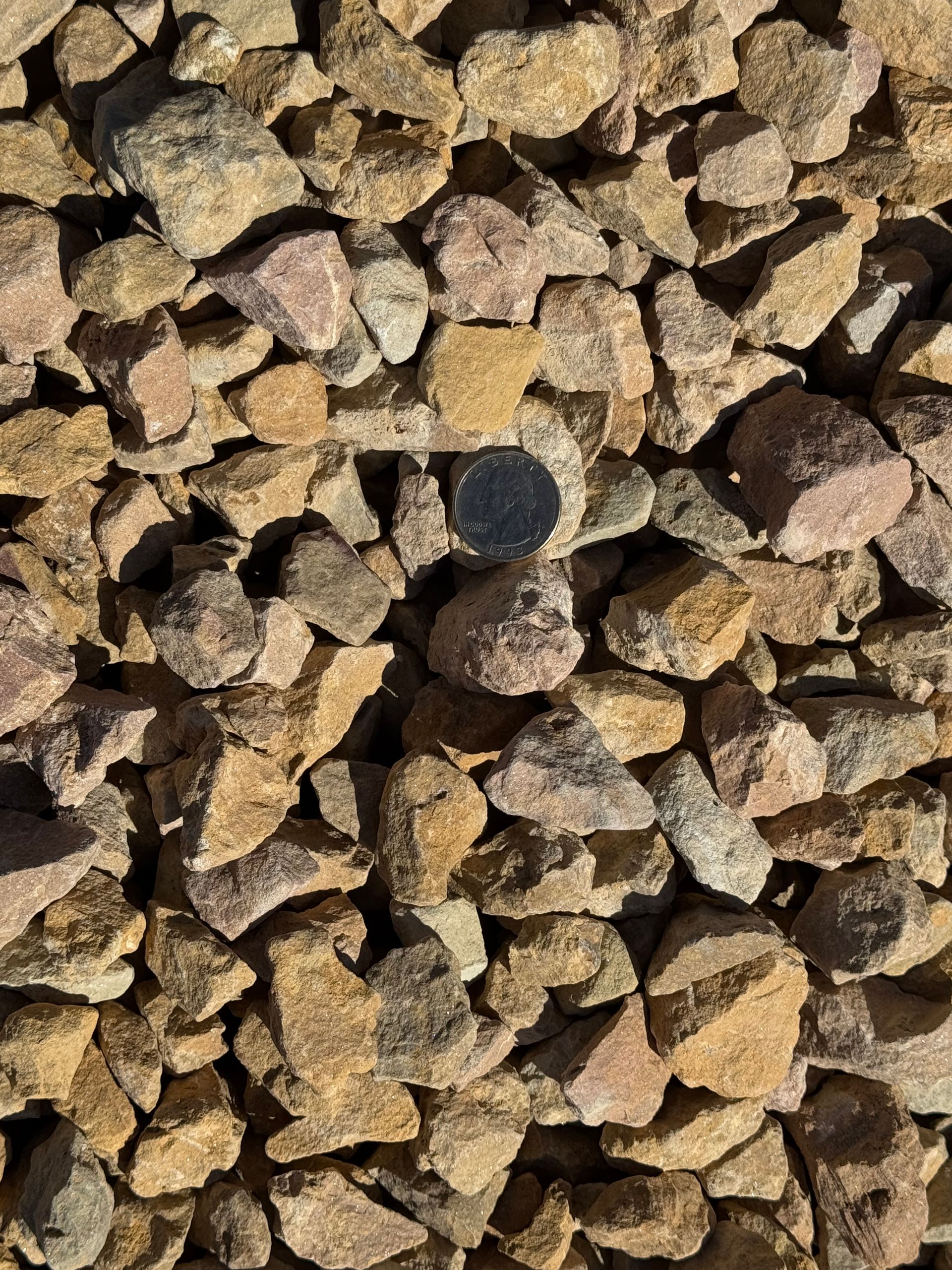A pile of gravel is sitting on top of each other.