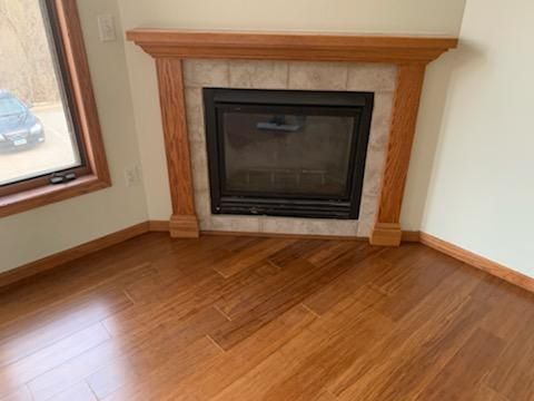 A fireplace in the corner of the room