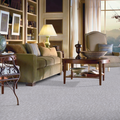 A living room with a couch a chair and a table