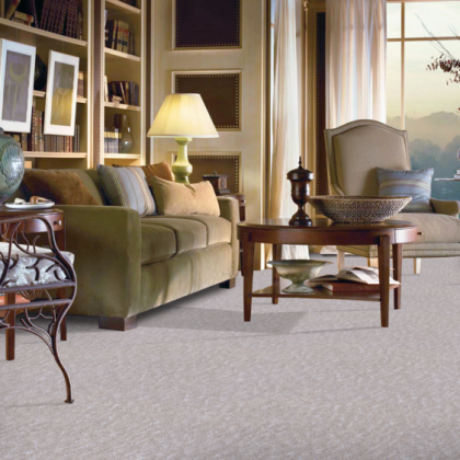 A living room with a couch a chair and a table