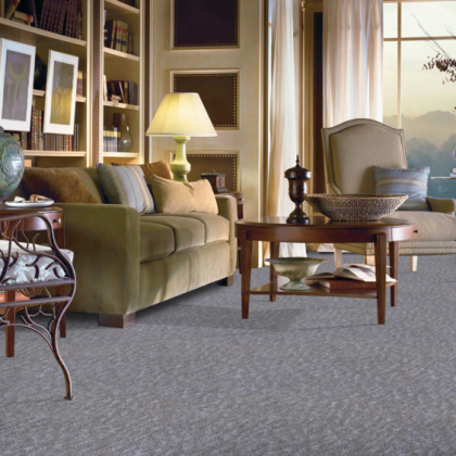 A living room with a couch a chair and a table