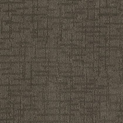 A close up of a brown carpet with a pattern on it.