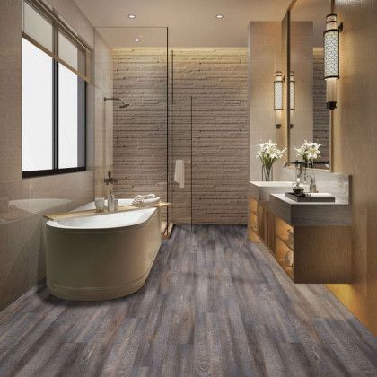 A bathroom with a bathtub , sinks , and a walk in shower.