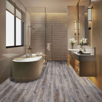 A bathroom with a bathtub , sinks , and a walk in shower.