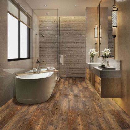 A bathroom with a bathtub , sinks , and a walk in shower.