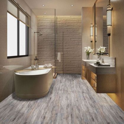 A bathroom with a bathtub , sinks , and a walk in shower.