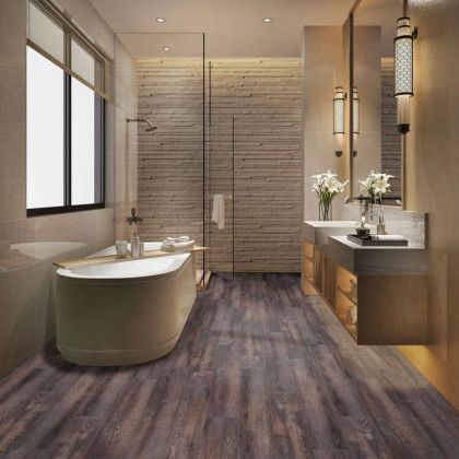 A bathroom with a tub , sinks , mirrors and a walk in shower.