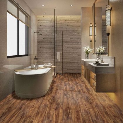 A bathroom with a bathtub , sinks , and a walk in shower.