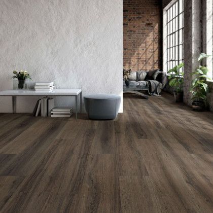 A living room with hardwood floors and a couch.