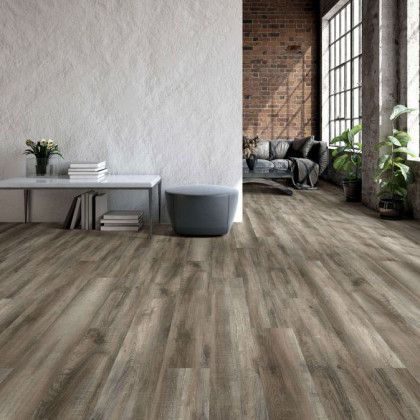 A living room with hardwood floors and a couch.