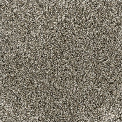 A close up of a carpet with a lot of small stones on it.