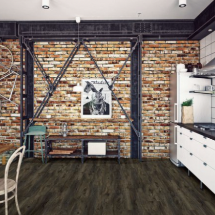 A kitchen with a brick wall and a picture on the wall
