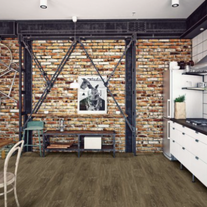 A kitchen with a brick wall and a picture of a rabbit on the wall