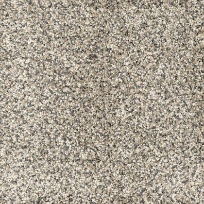 A close up of a carpet with a lot of small stones on it.