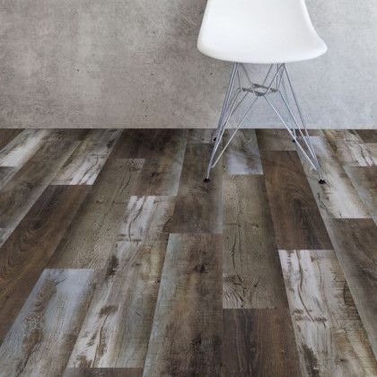 A chair is sitting on a wooden floor next to a wall.