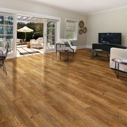 A living room with hardwood floors and a television