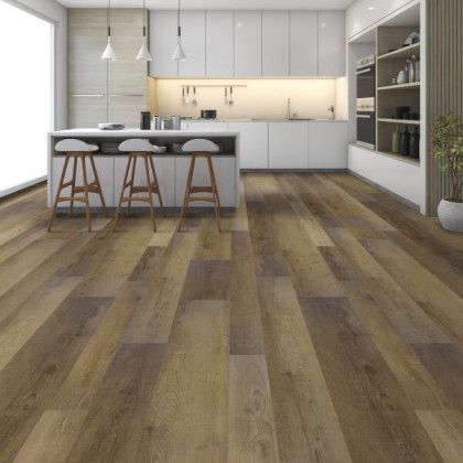 A kitchen with hardwood floors and white cabinets and stools.