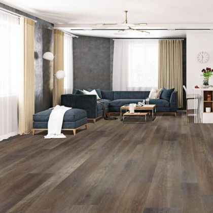 A living room with hardwood floors and a couch.