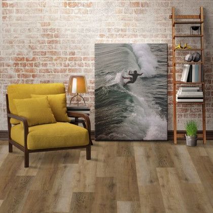 A living room with a yellow chair and a painting of a surfer on the wall.