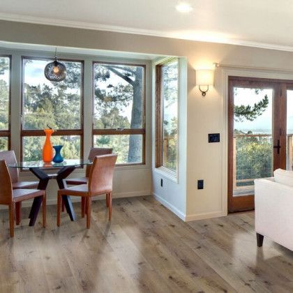 A living room with a table and chairs and a couch