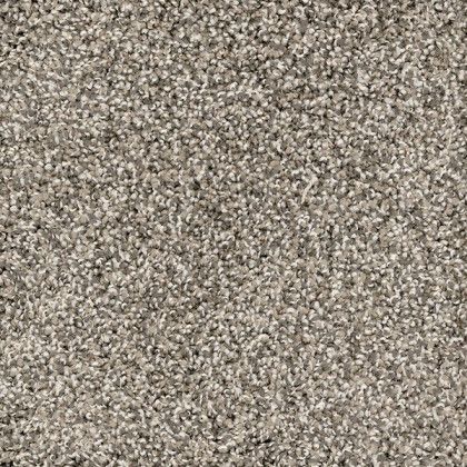 A close up of a carpet with a lot of small stones on it.