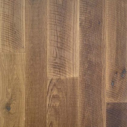 A close up of a wooden floor with a grain and texture.