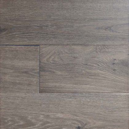 A close up of a wooden floor with a rectangle in the middle.
