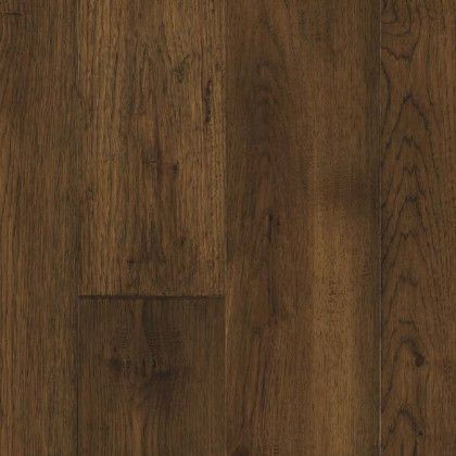 A close up of a dark brown wooden floor.