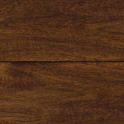 A close up of a piece of dark wood.