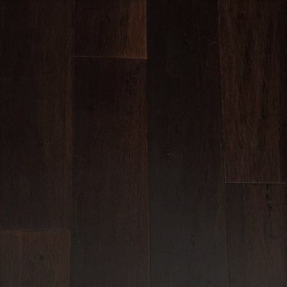 A close up of a dark brown wooden floor.