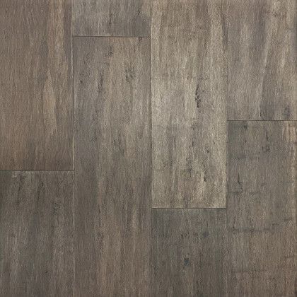 A close up of a wooden floor with a grainy texture.