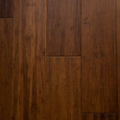 A close up of a wooden floor with a grainy texture.