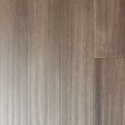 A close up of a wooden floor with a grainy texture.