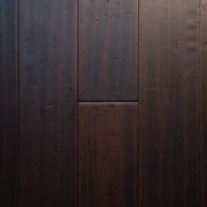 A close up of a dark brown wooden floor.