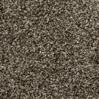A close up of a pile of brown carpet.