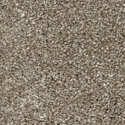 A close up of a carpet with a lot of small stones on it.