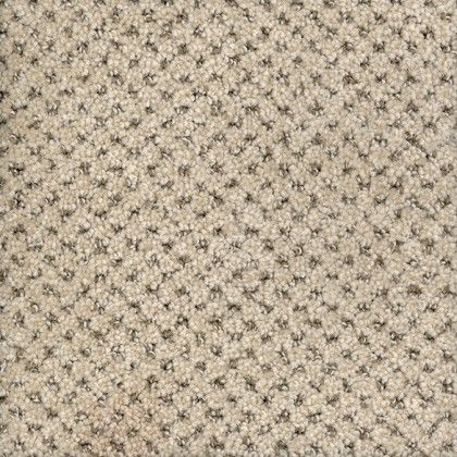 A close up of a carpet with a pattern on it.