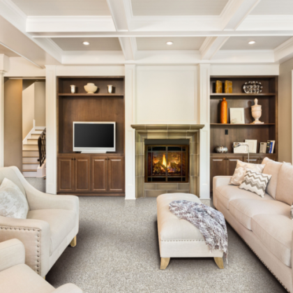 A living room with a fireplace and a flat screen tv